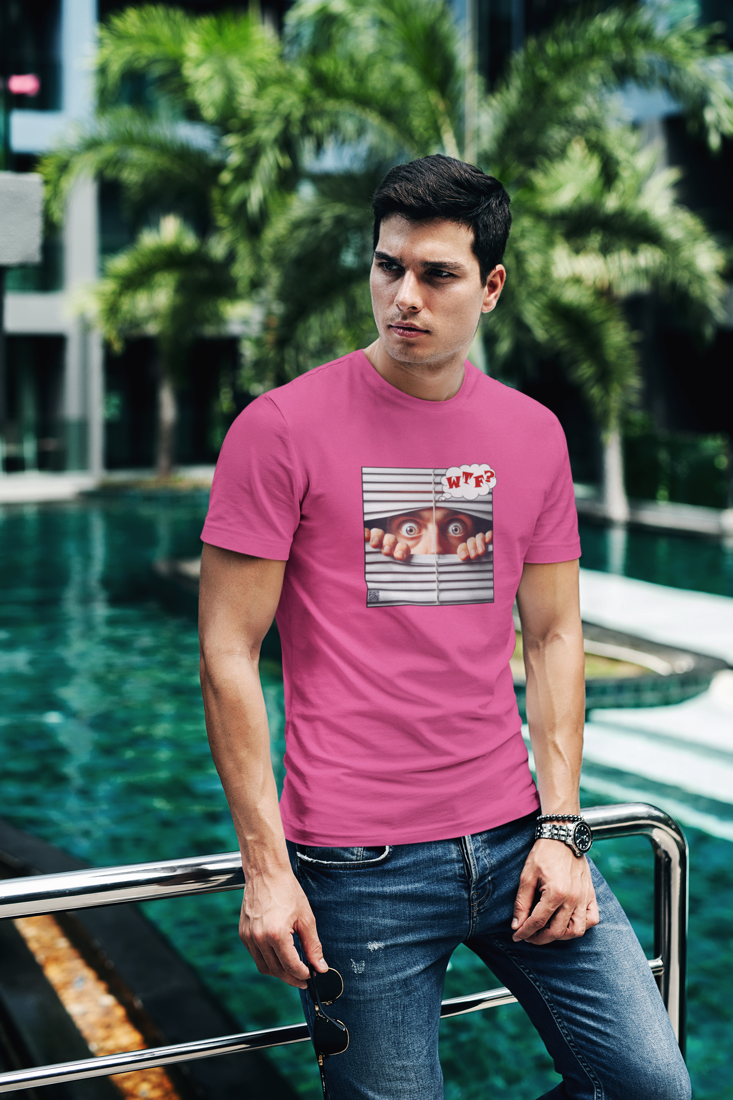Model wearing a pink WTF White Male Model Activist Tshirt by jthomascrowne, standing by a poolside.