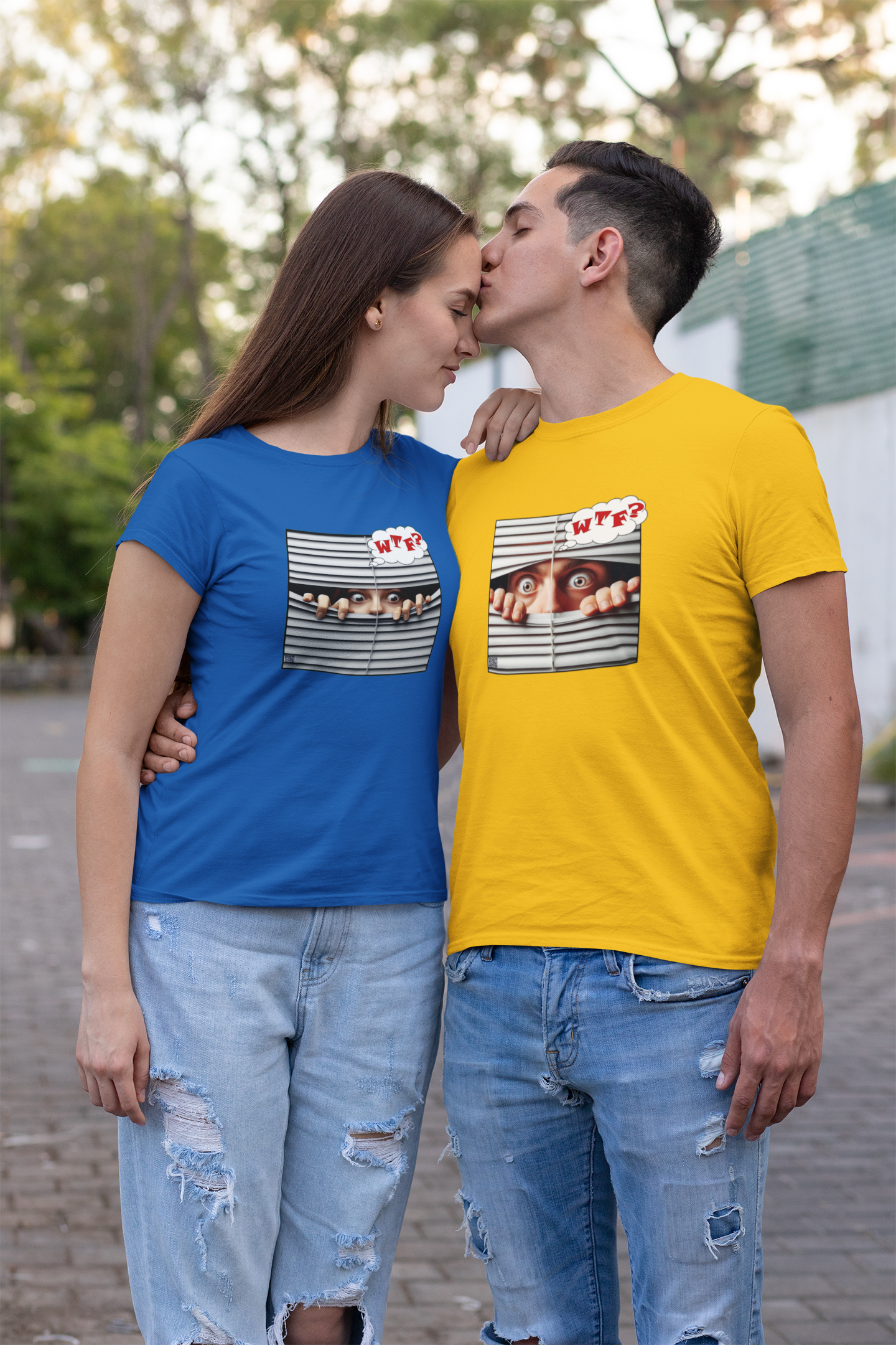 Two models wearing WTF White Male Model Activist Tshirts, one blue and one yellow, sharing a sweet moment outdoors.
