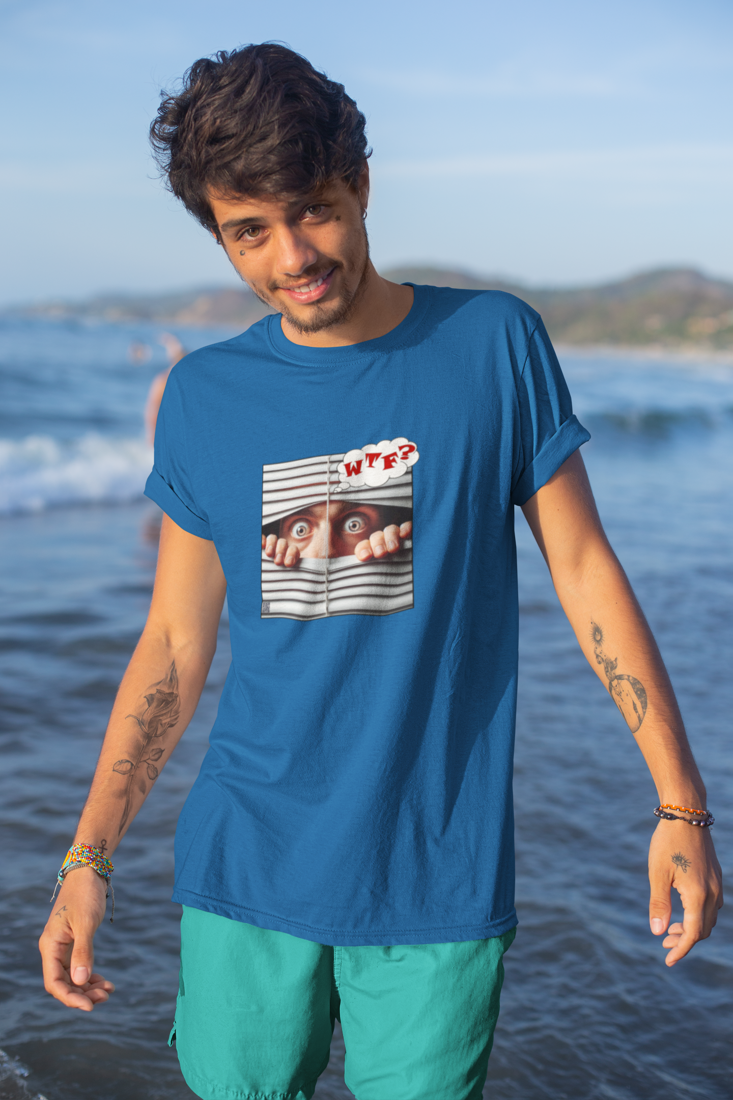 Model wearing WTF White Male Model Activist Tshirt at the beach, showcasing a fun and bold design.