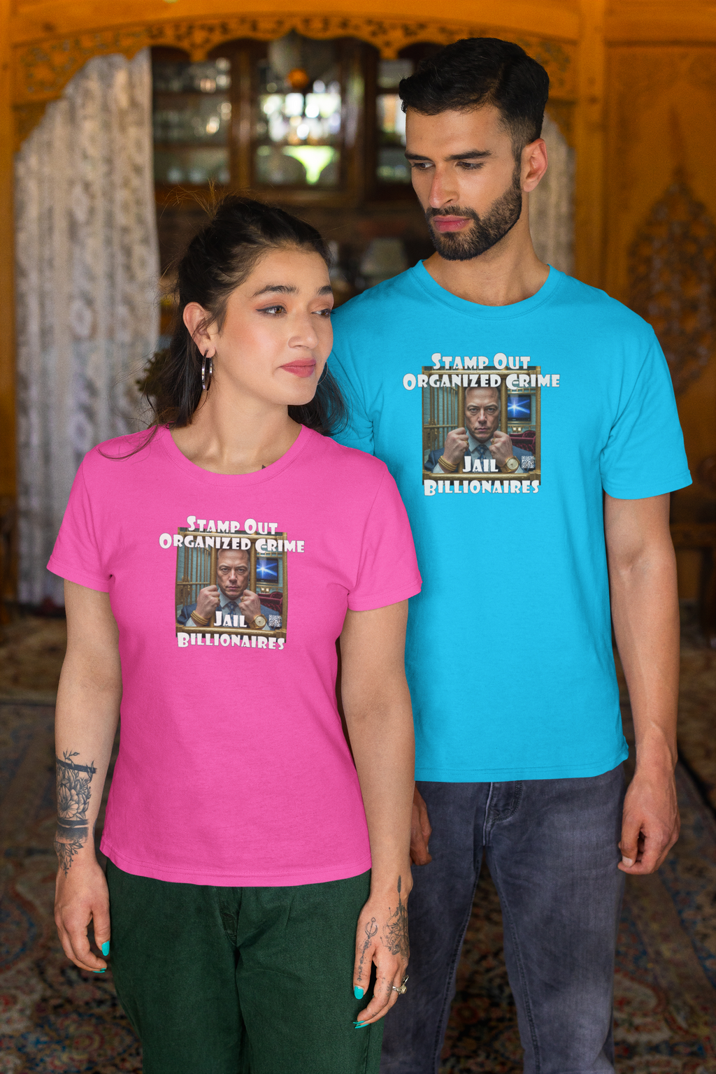 Two models wearing the Stamp Out Organized Crime-Jail Billionaires Activist T-shirt in pink and blue.