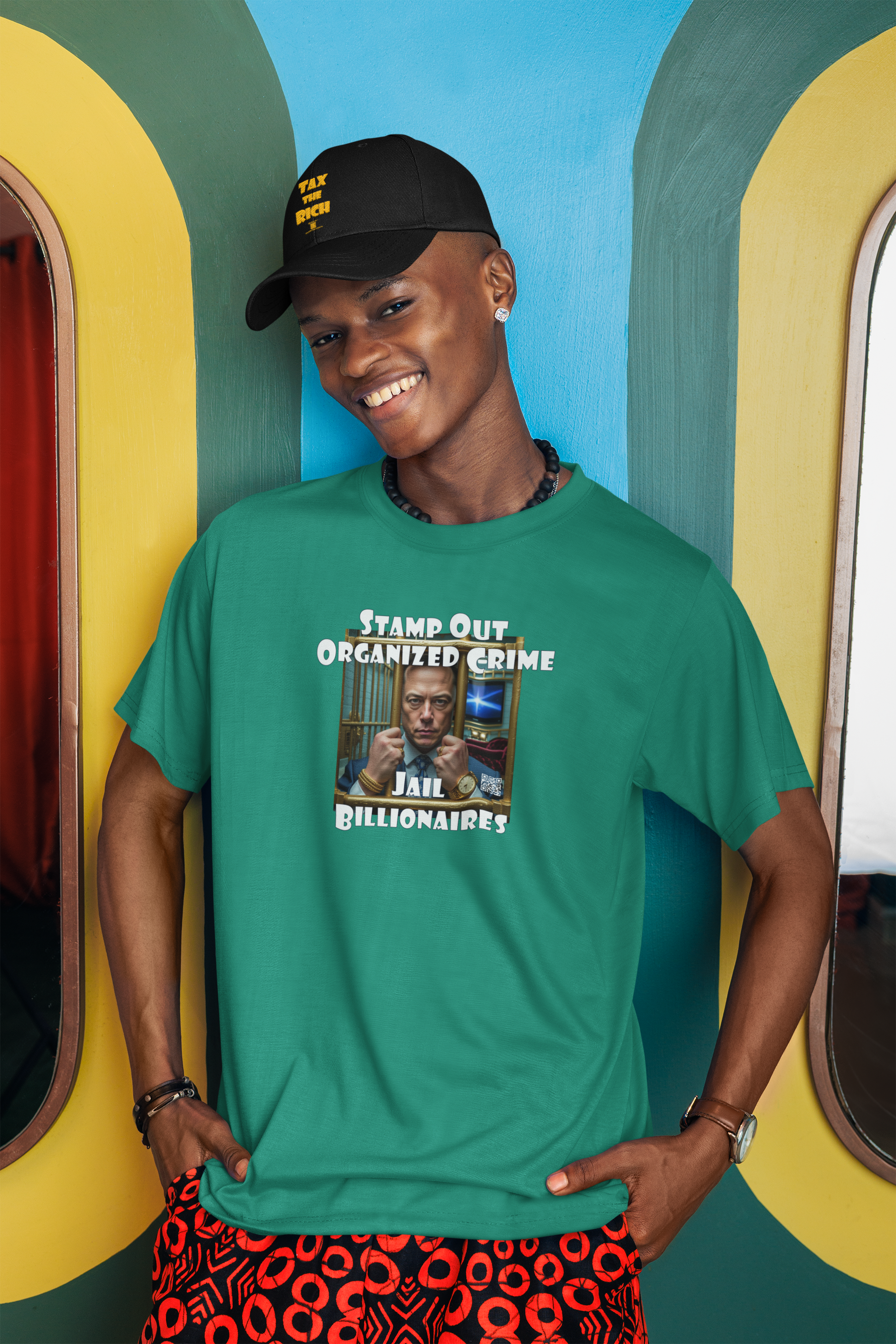 Person wearing a teal t-shirt featuring the text 'Stamp Out Organized Crime-Jail Billionaires Activist T-shirt'.