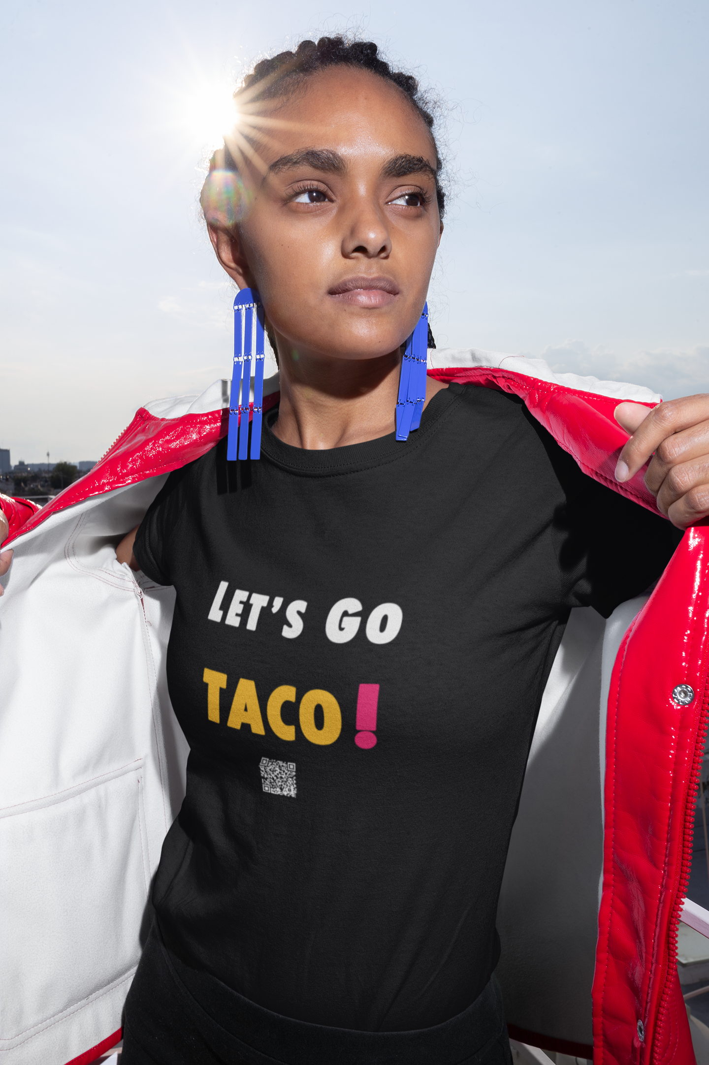 Model wearing TACO Activist TShirt with bold lettering, promoting political activism and humor.