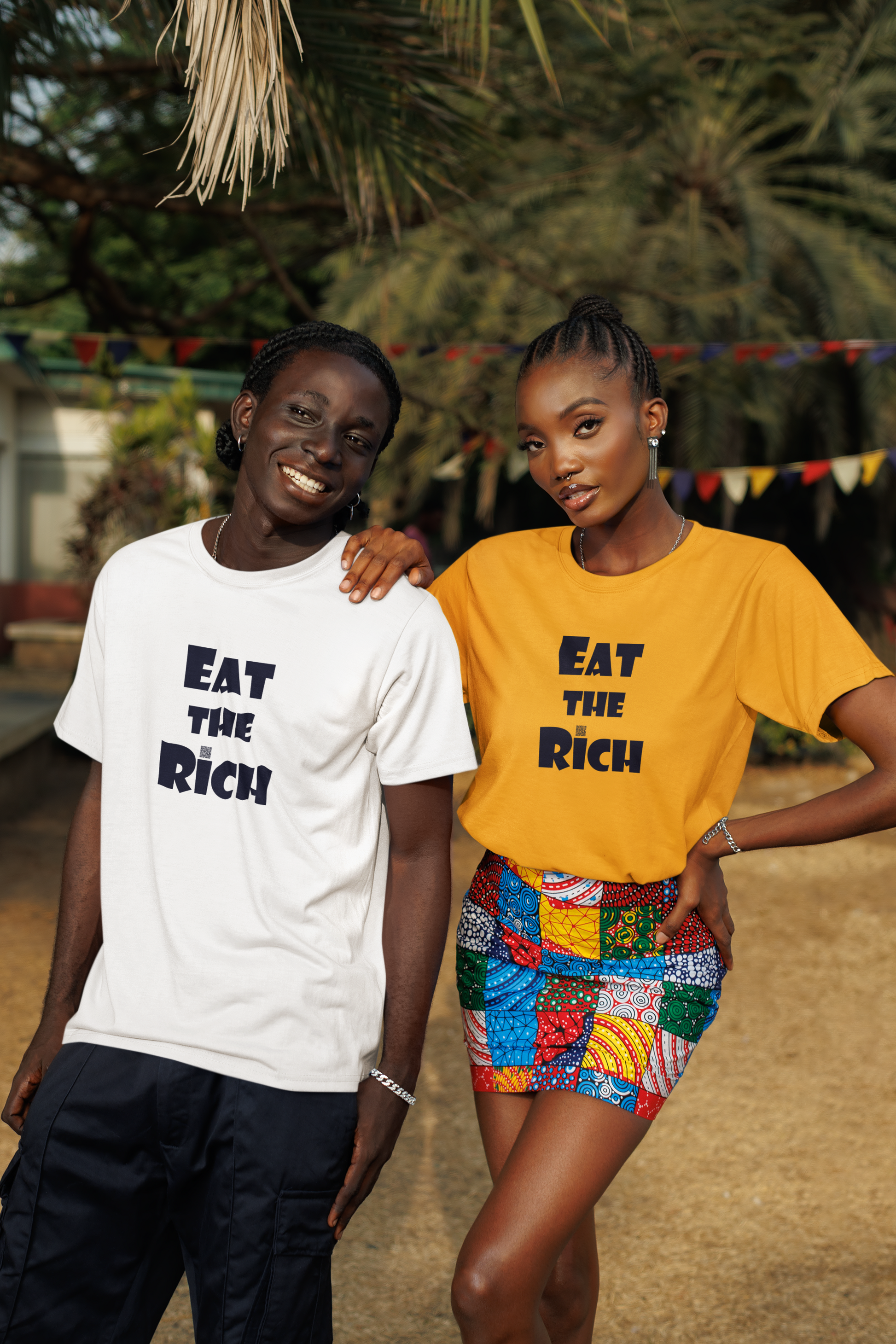 Two models wearing EAT THE RICH Unisex TShirts, one in white and one in yellow, showcasing bold designs.