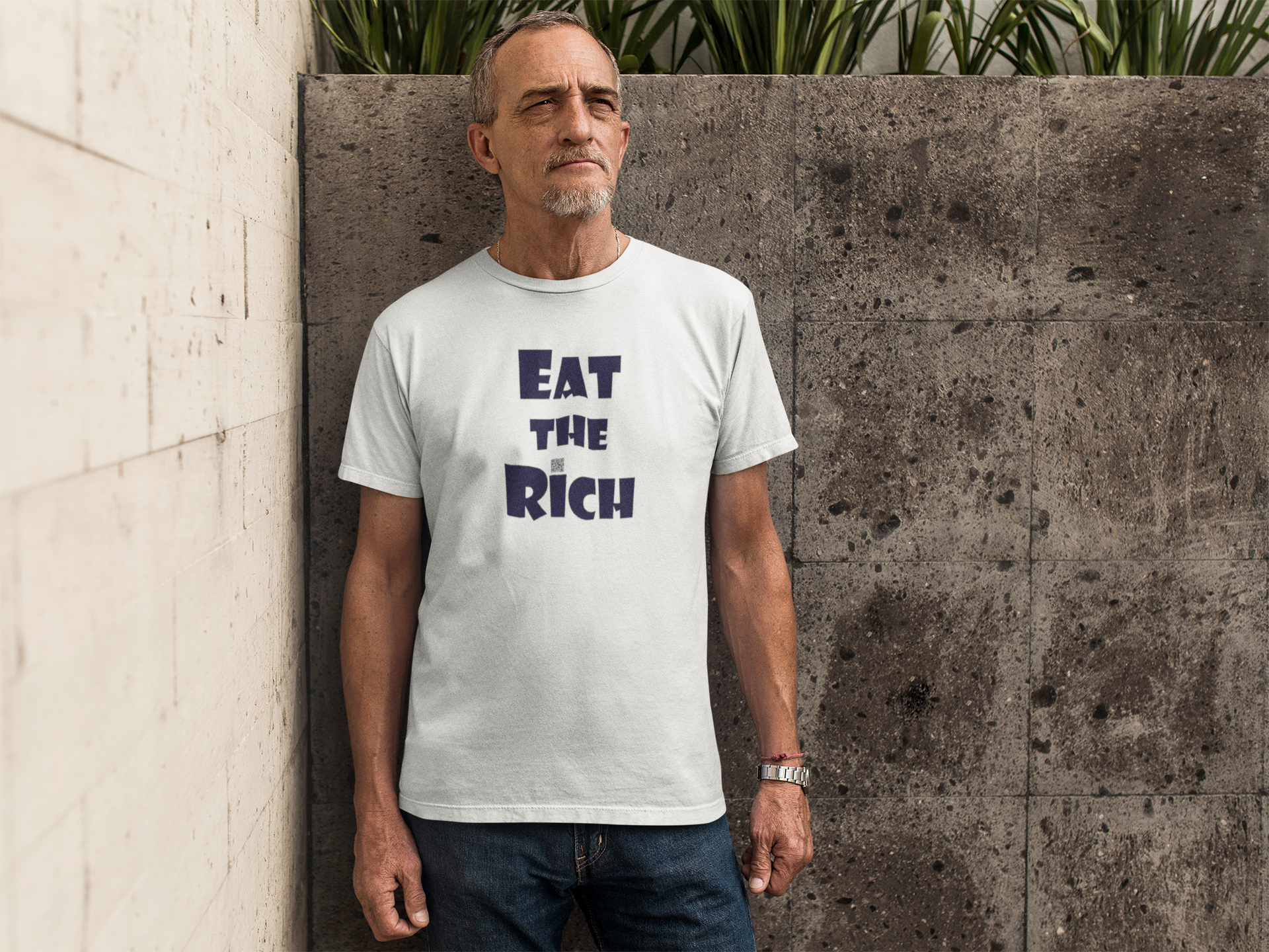 EAT THE RICH Unisex TShirt worn by a man, featuring bold typography on a white background.