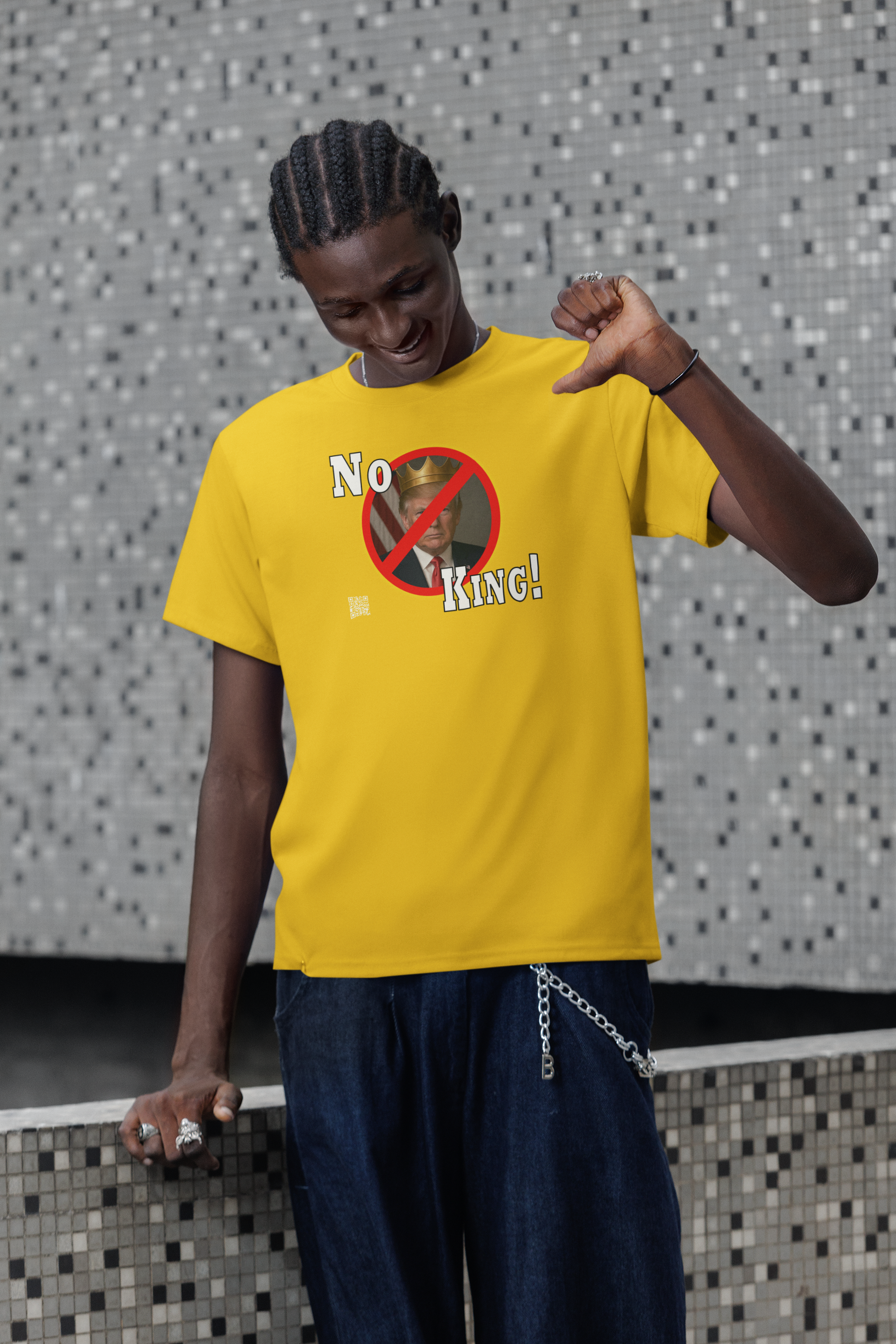 No King Activist TShirt worn by a young man with a stylish vibe in a modern setting.