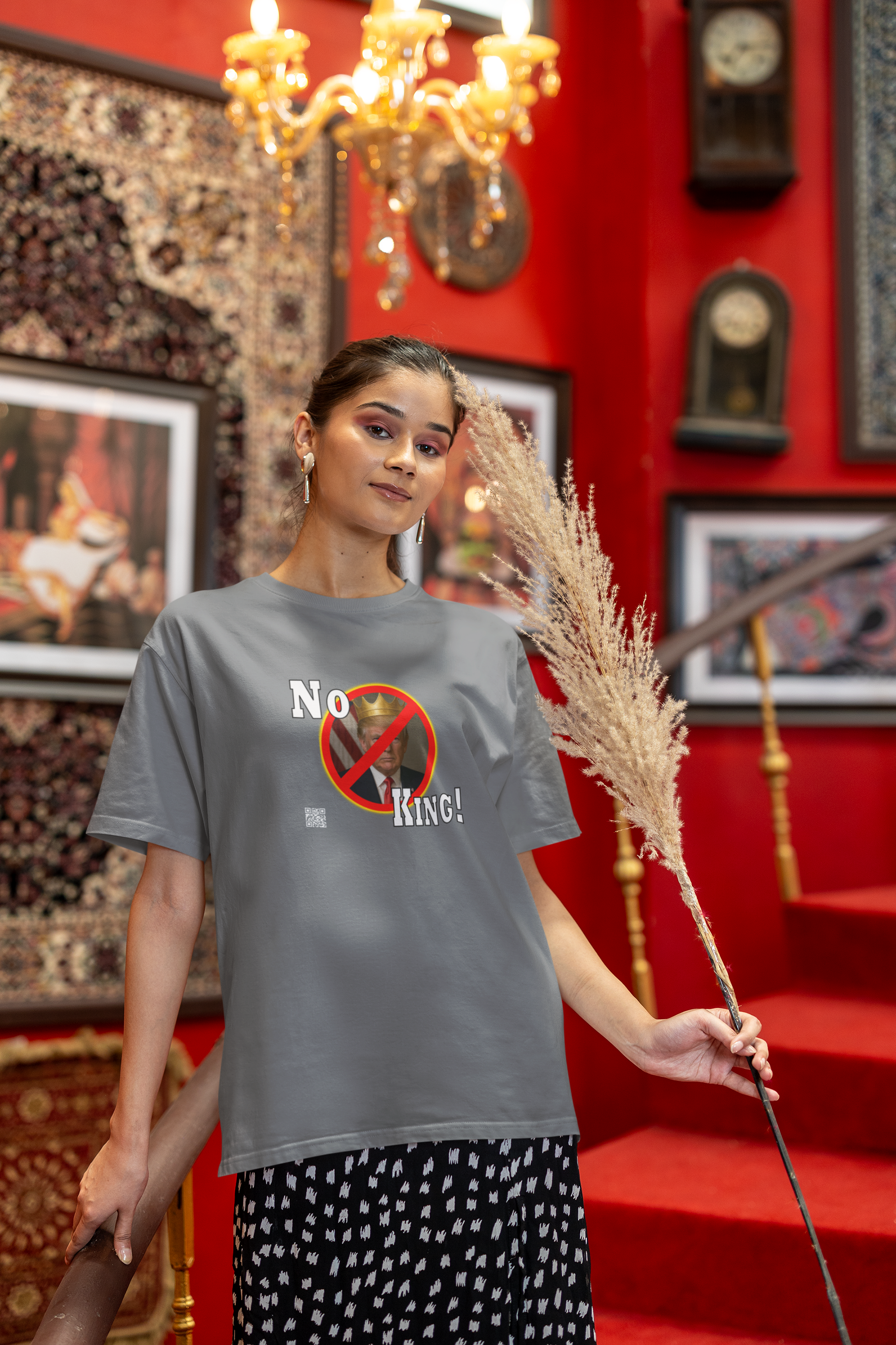 Model wearing No King Activist TShirt, promoting democracy in a stylish indoor setting.