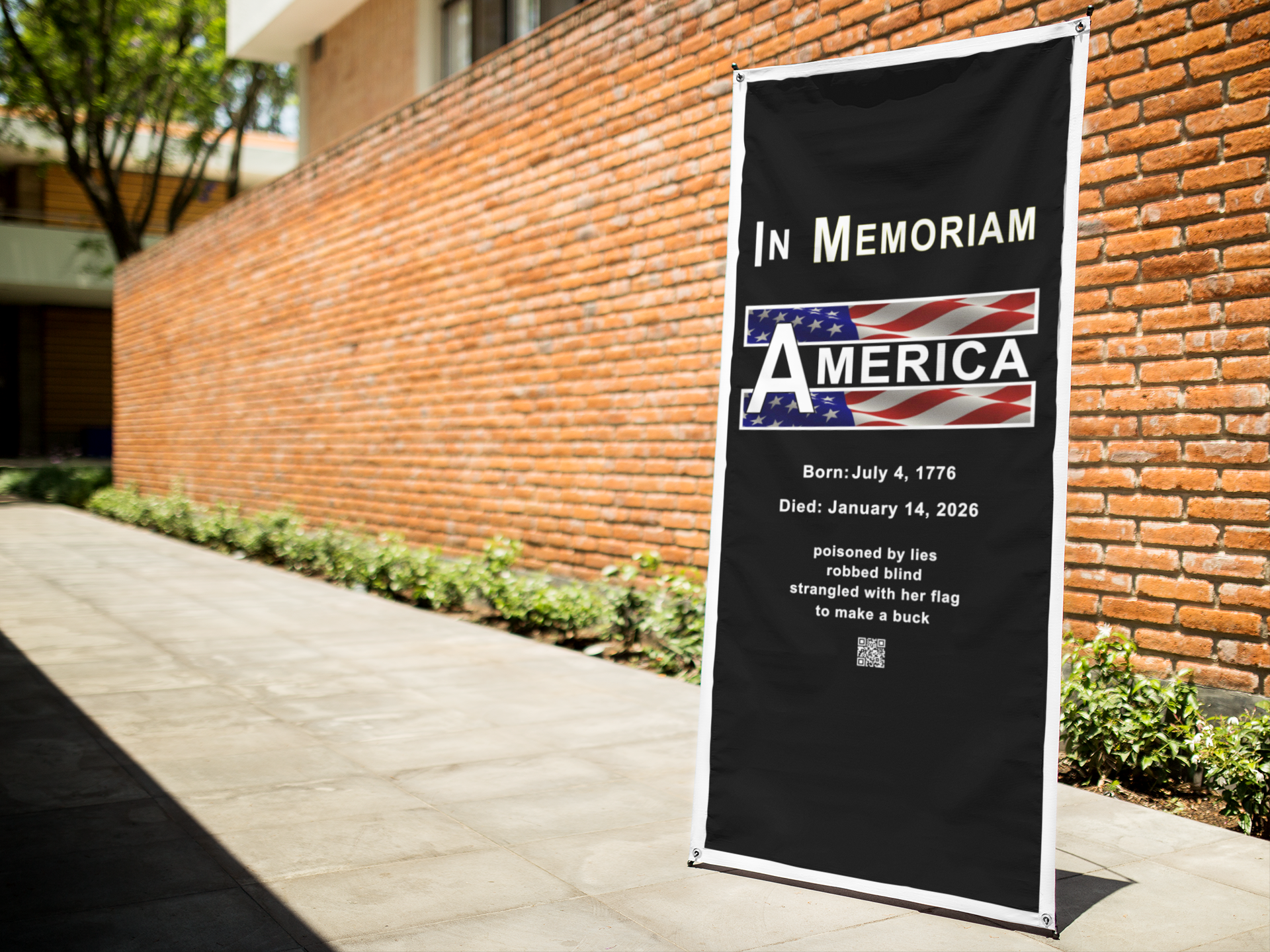 In Memoriam-American Democracy 1776 to 2026 Vertical Protest Banner displayed outdoors in a brick wall setting.