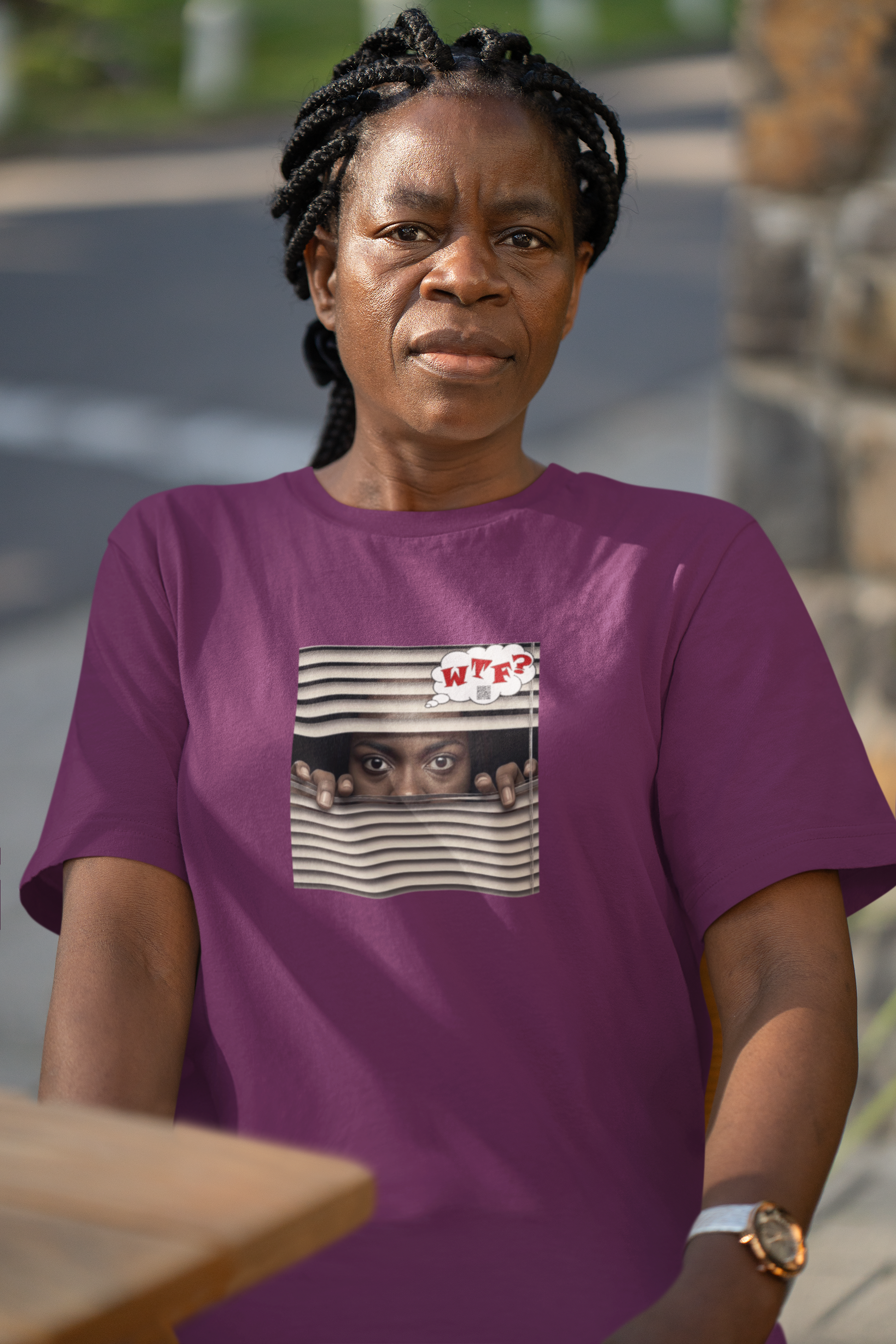 WTF Activist T-Shirt Black Female Model worn by a woman with braided hair, showcasing a unique design with humor.