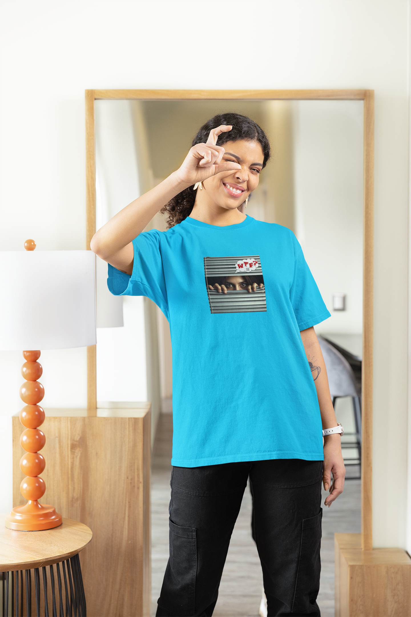 Model wearing WTF Hispanic female activist t-shirt, showcasing its bold design and vibrant color.