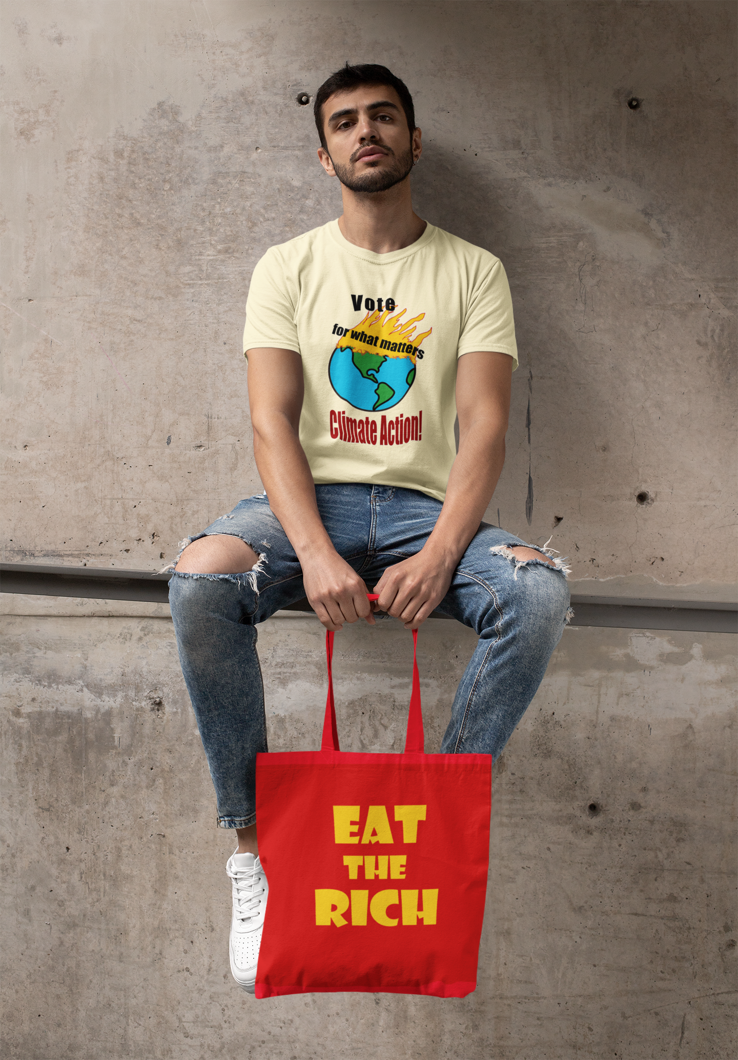 Model sitting with Eat the Rich accessory tote bag and a climate action t-shirt.