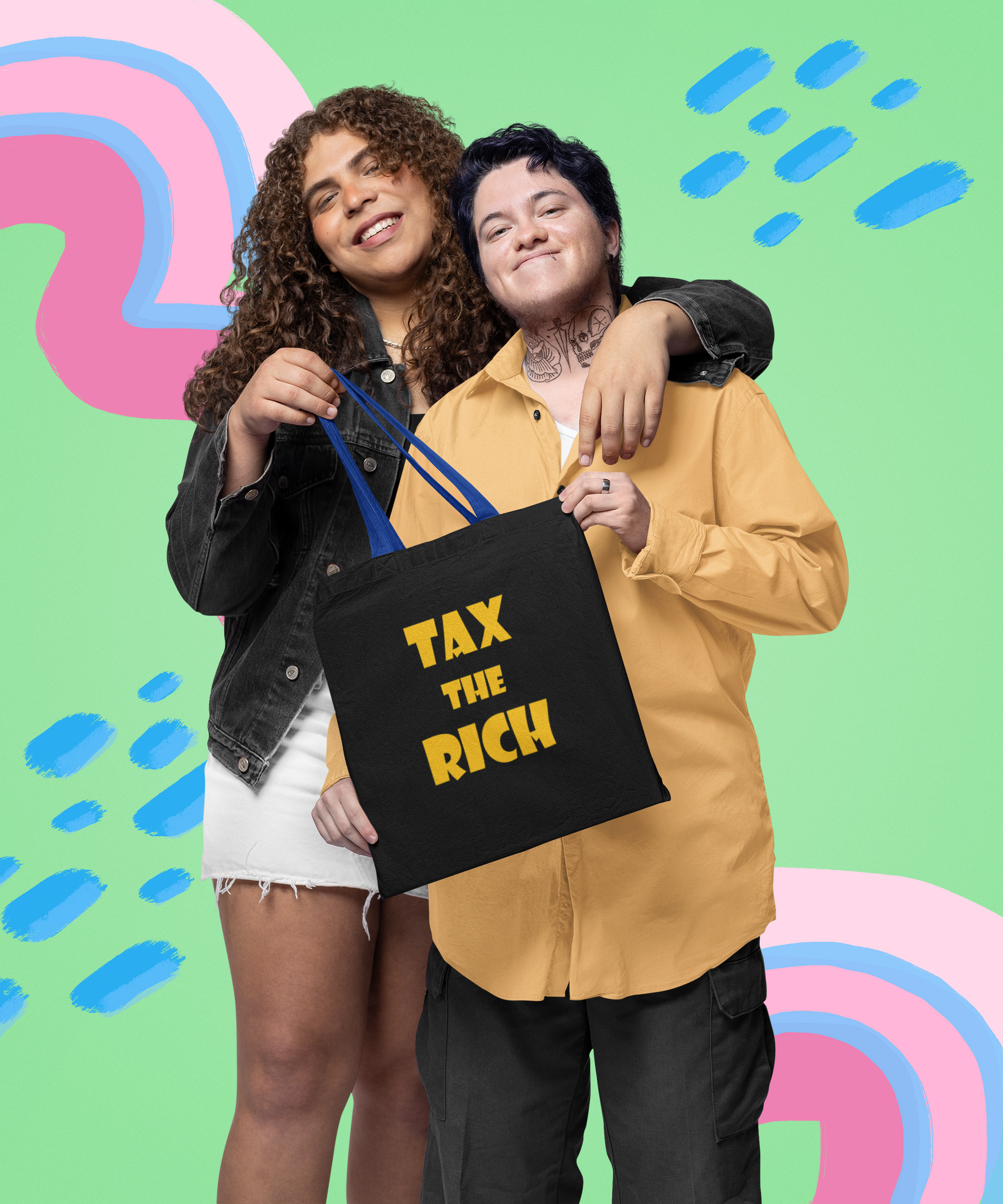 Two people smiling while holding a Tax the Rich accessory tote bag against a colorful background.