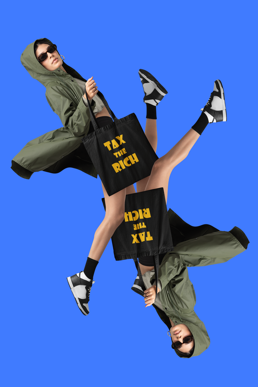 Model showcasing the Tax the Rich accessory tote bag against a bold blue backdrop.