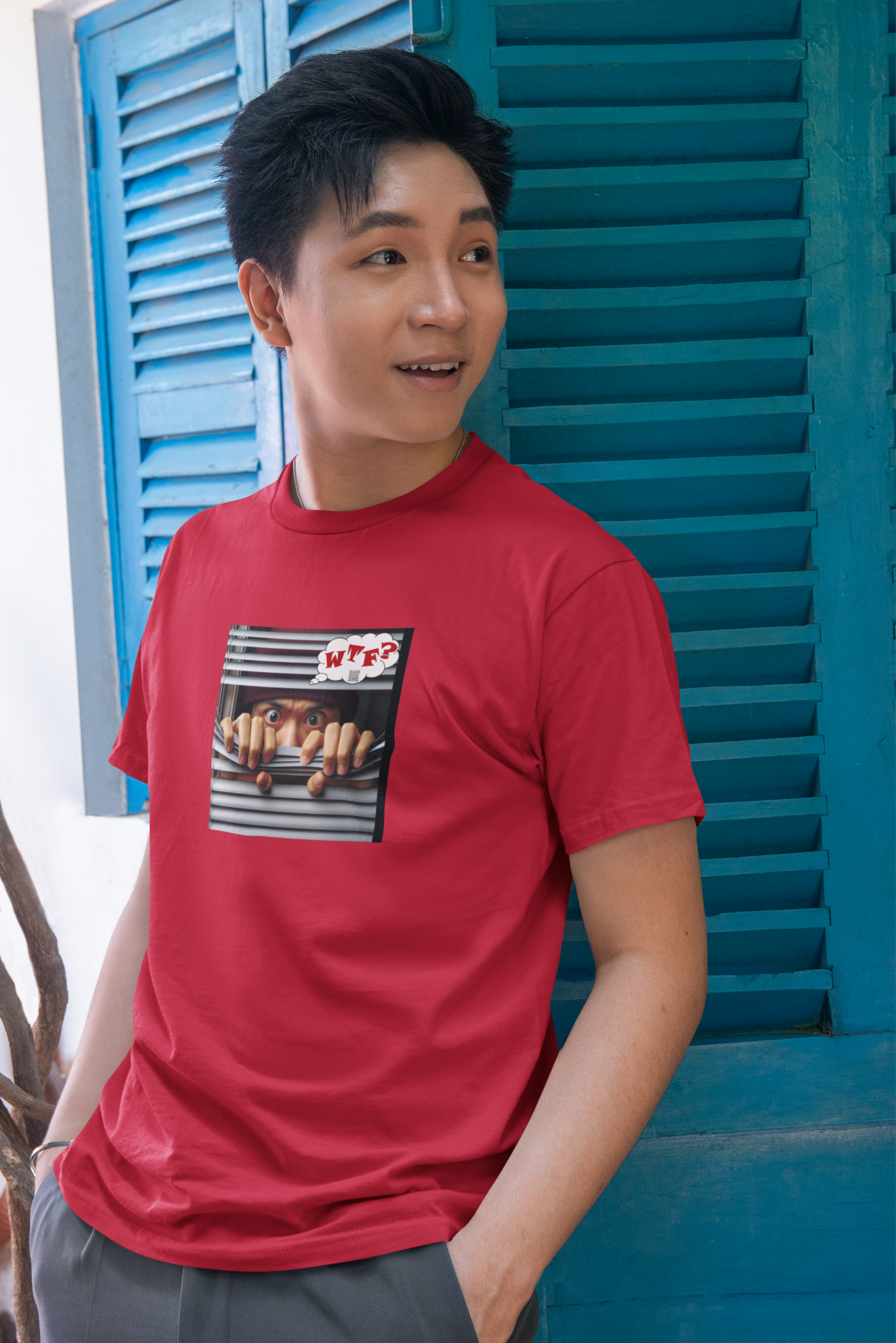WTF activist t-shirt for Asian male model worn by a young man in front of blue shutters.