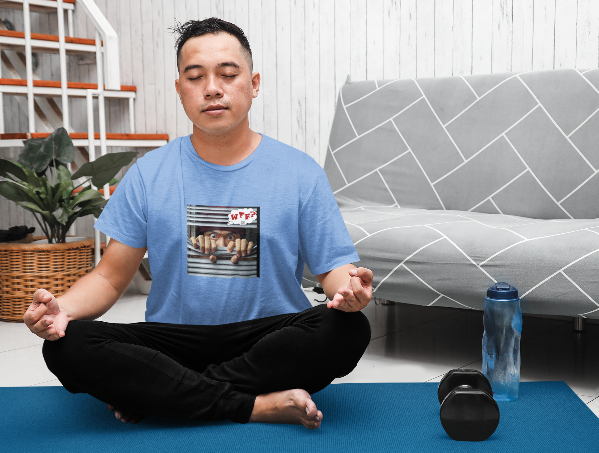 WTF activist t-shirt for Asian male model worn by a man meditating in a living room setting.