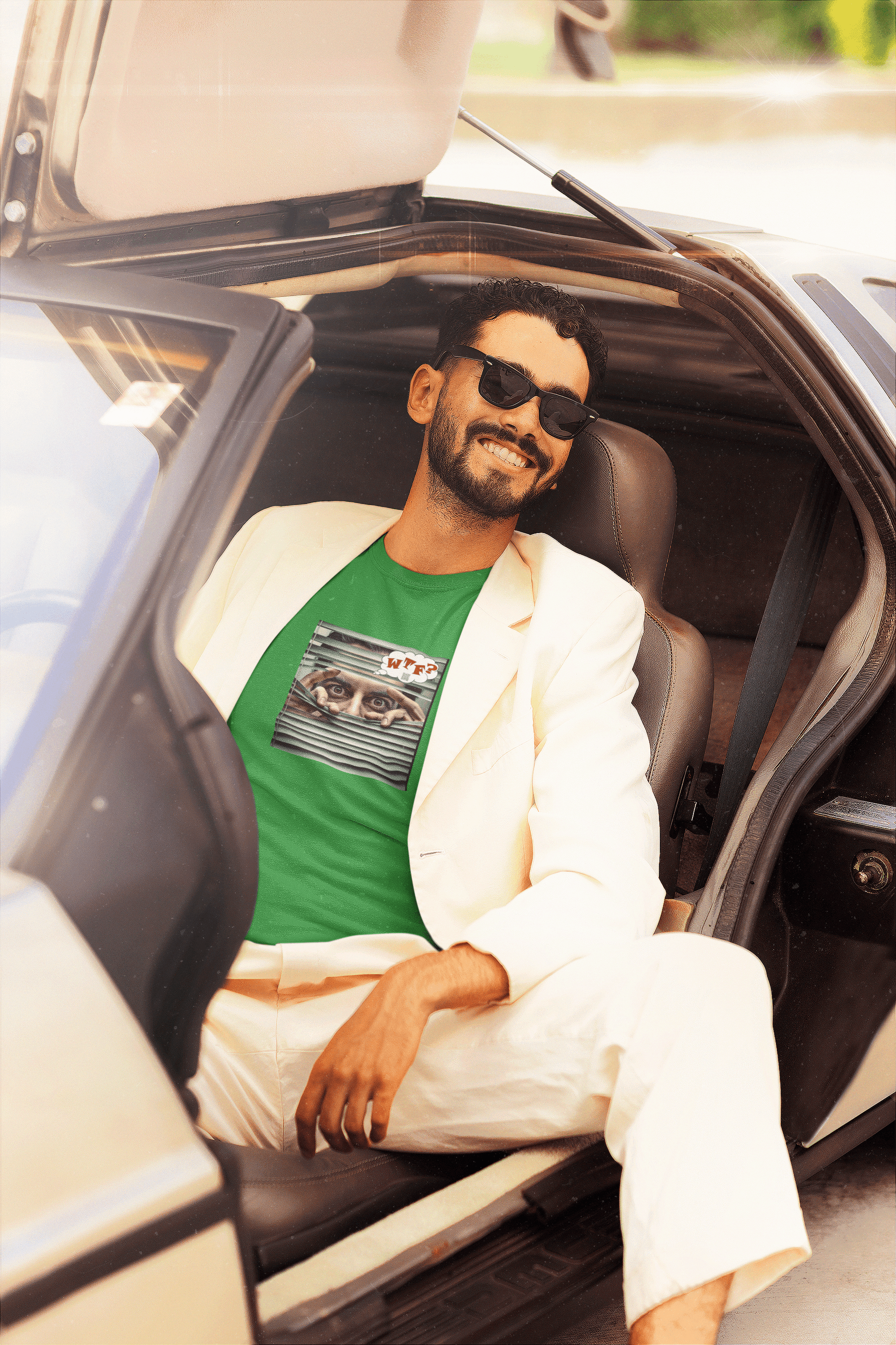 WTF activist t-shirt Hispanic male model, stylishly posed in a car.