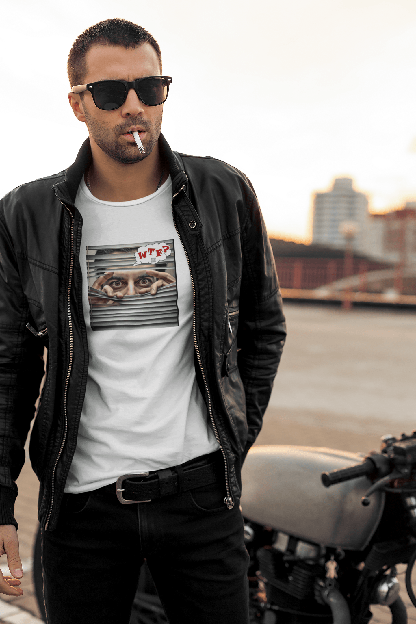 WTF activist t-shirt Hispanic male model, leather jacket, and sunglasses, standing by a motorcycle.