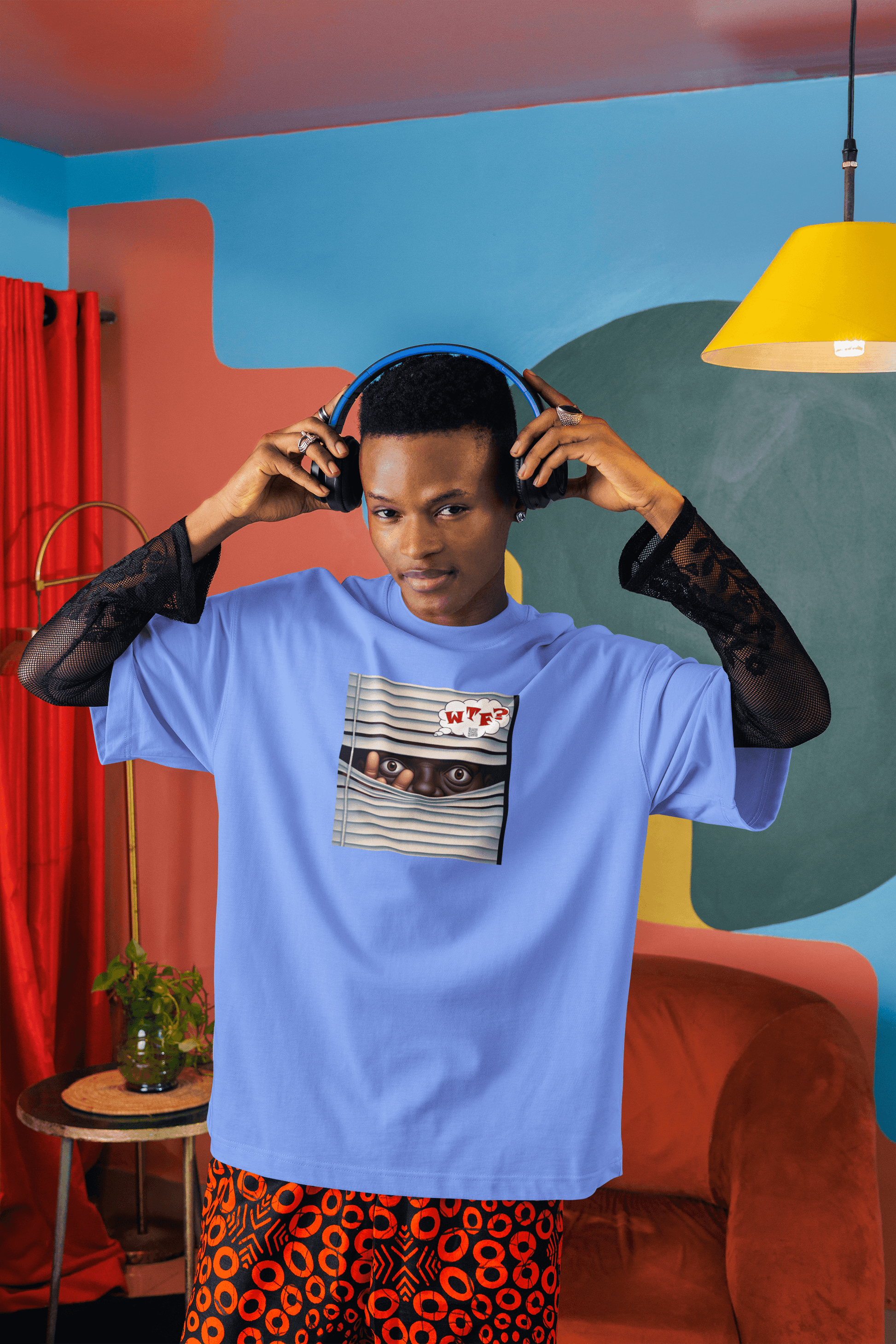 WTF Activist T-Shirt - Black Male Model Designed by jthomascrowne worn by a model with headphones in a colorful setting.