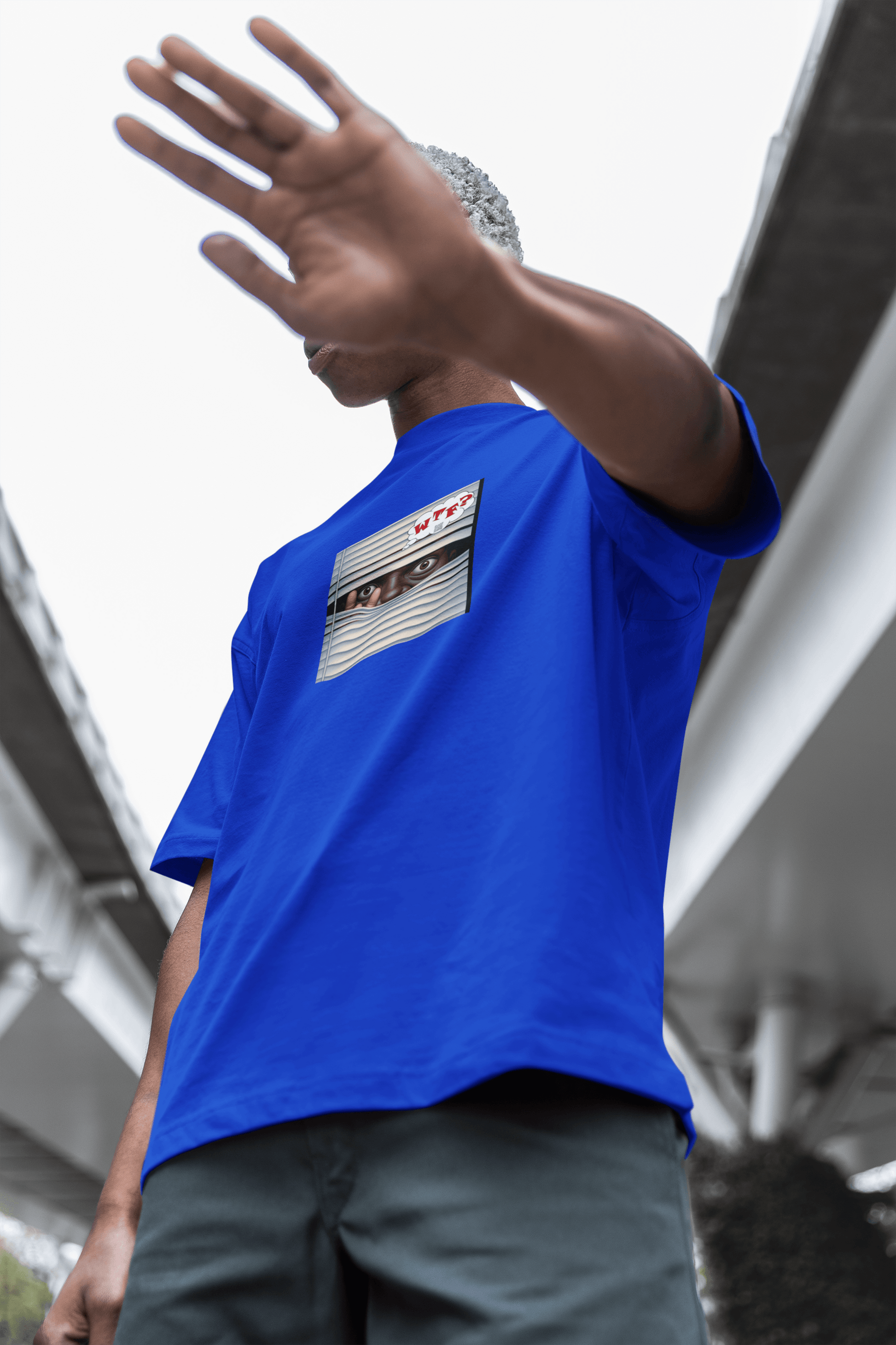 WTF Activist T-Shirt - Black Male Model Designed by jthomascrowne, blue shirt, model posing outdoors, urban backdrop.