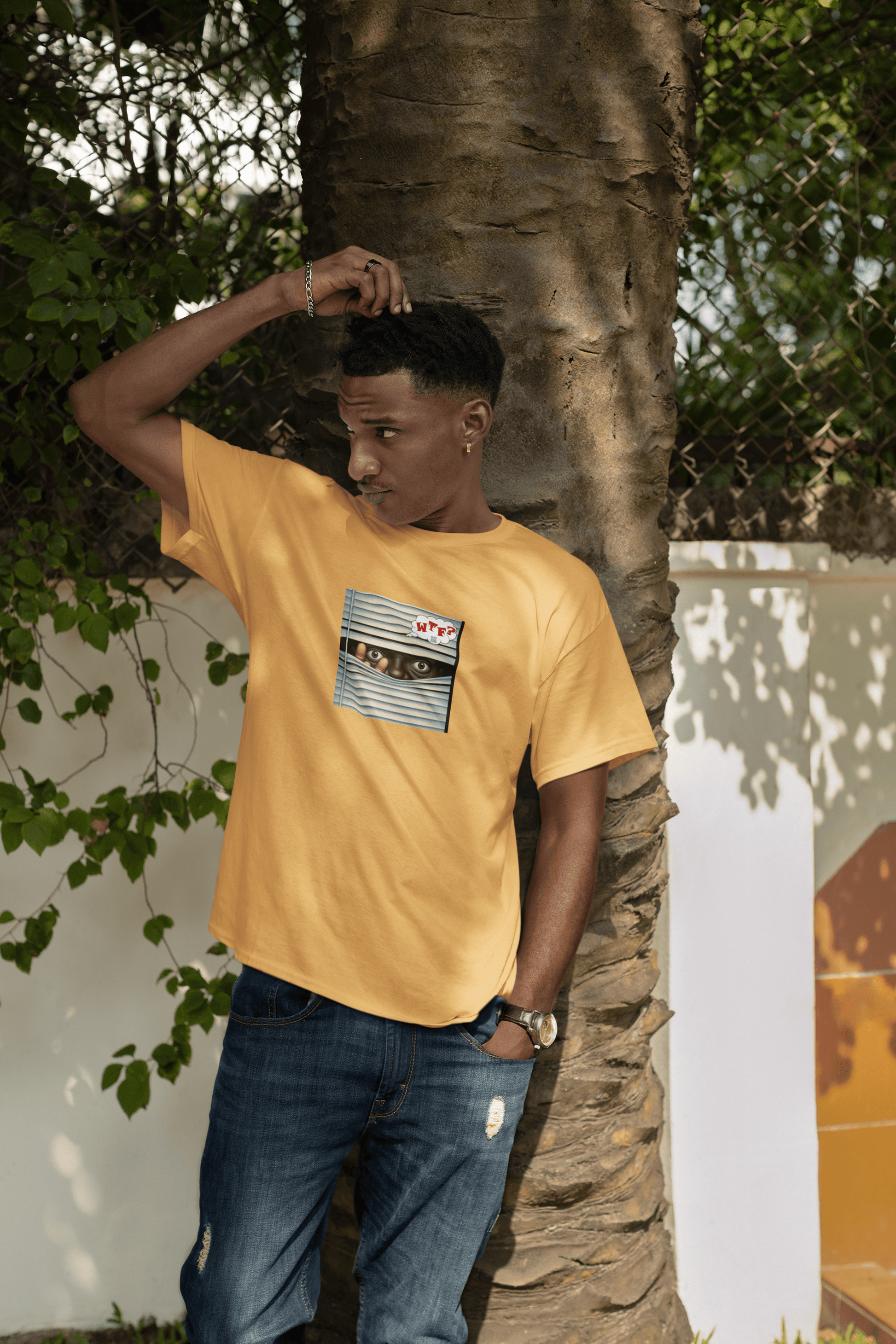 WTF Activist T-Shirt - Black Male Model Designed by jthomascrowne worn by a young man under a tree.