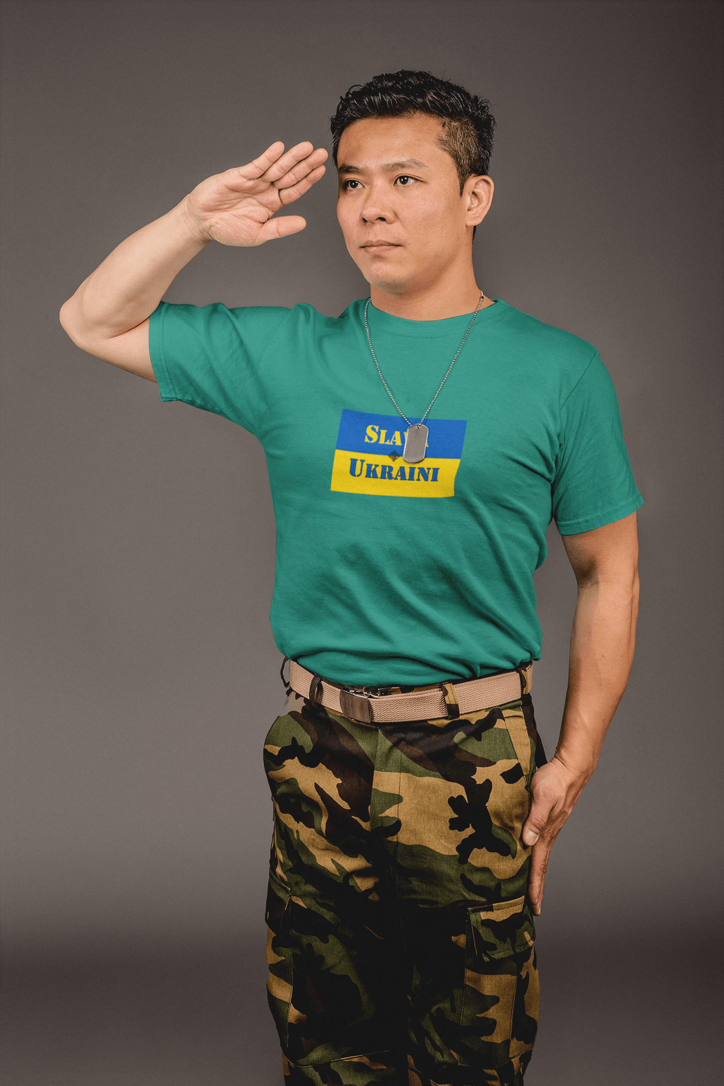 Man saluting while wearing a Slava Ukraini Tee Shirt with Ukrainian flag design.