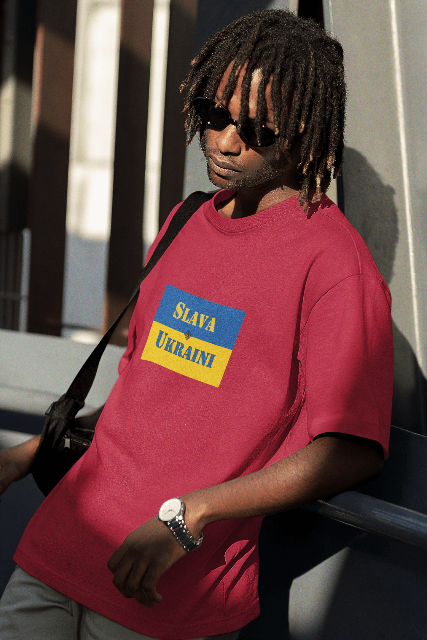 Person wearing a Slava Ukraini Tee Shirt, stylishly showcasing support for Ukraine.