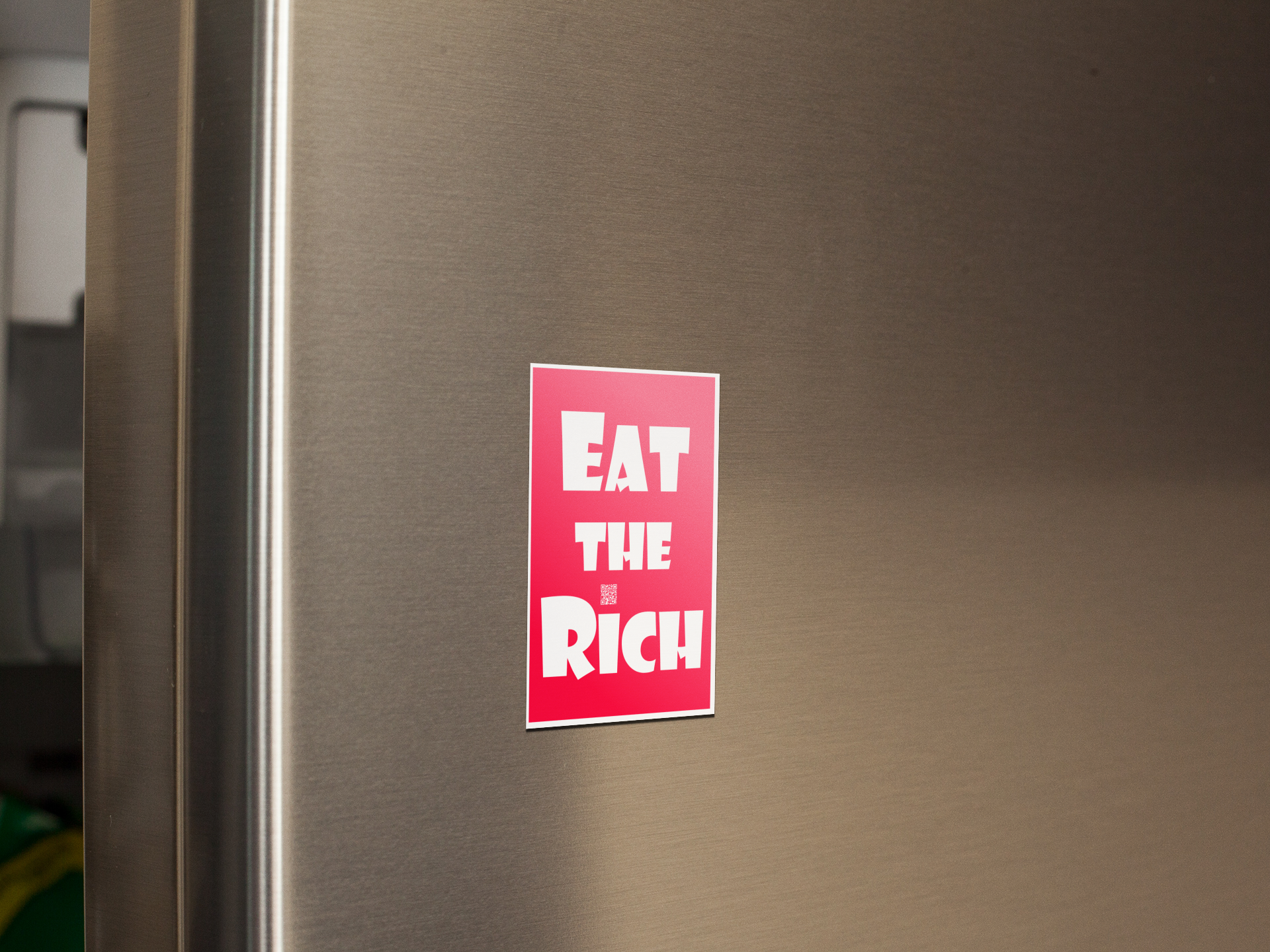 4" x 5" red magnet with white Eat the Rich lettering, on the door of a stainless steel refigerator door