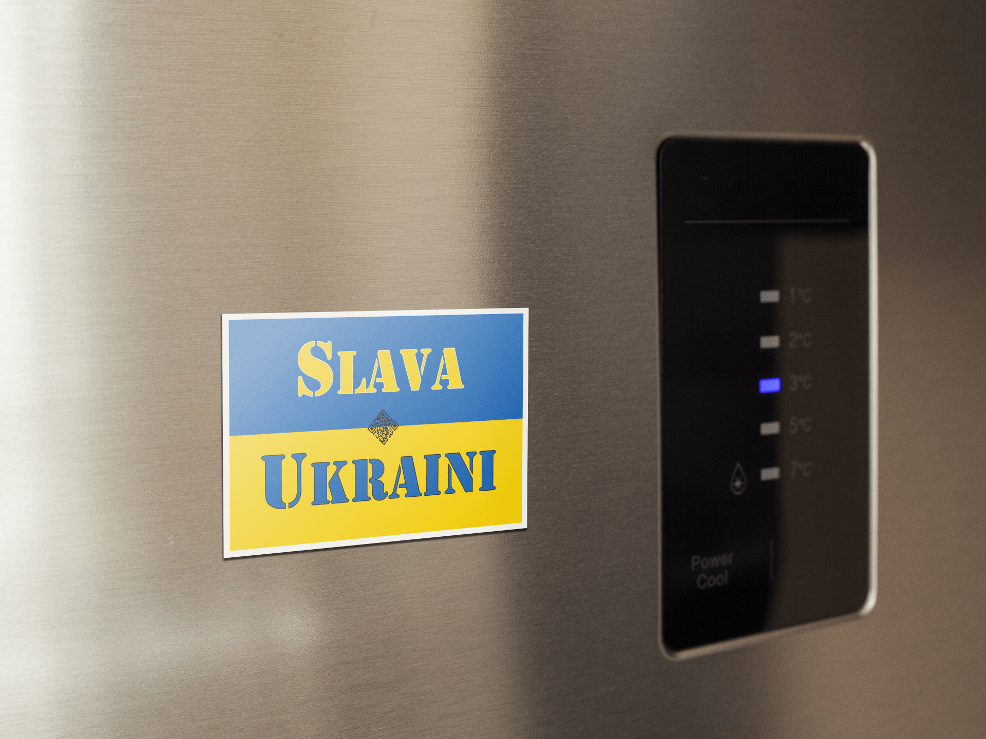 Slava Ukraini magnet displayed on a stainless steel refrigerator, supporting Ukraine and democracy.