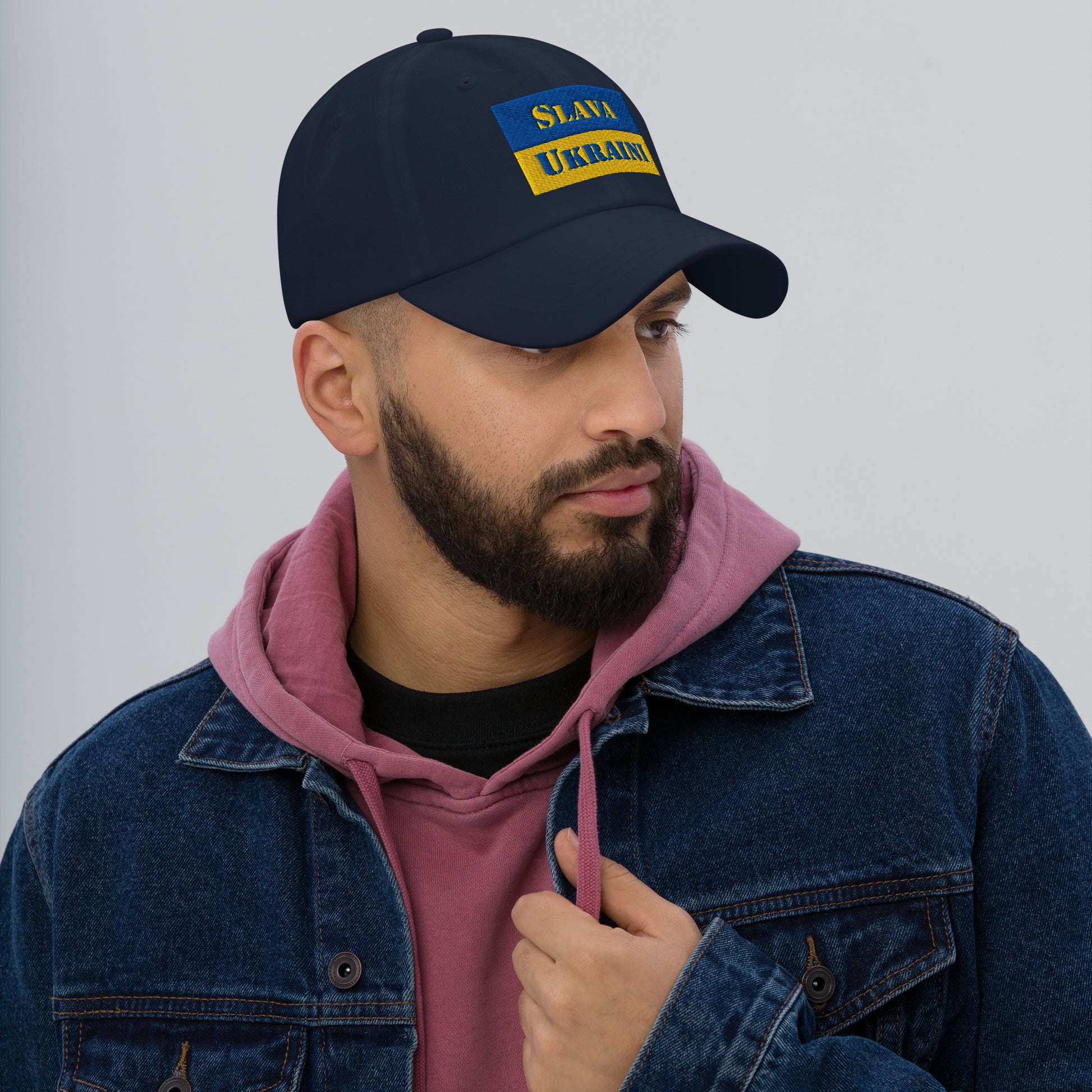 Slava Ukraini Embroidered Dad Hat worn by a model, showcasing its stylish design and support for Ukraine.